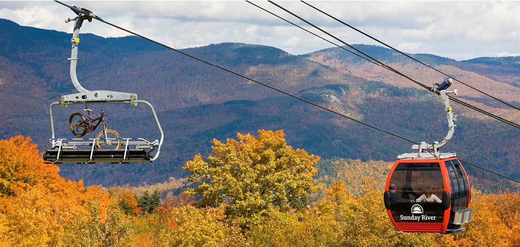 Gondola scenic ride over fall foliage near Sunday River and Bethel Maine
