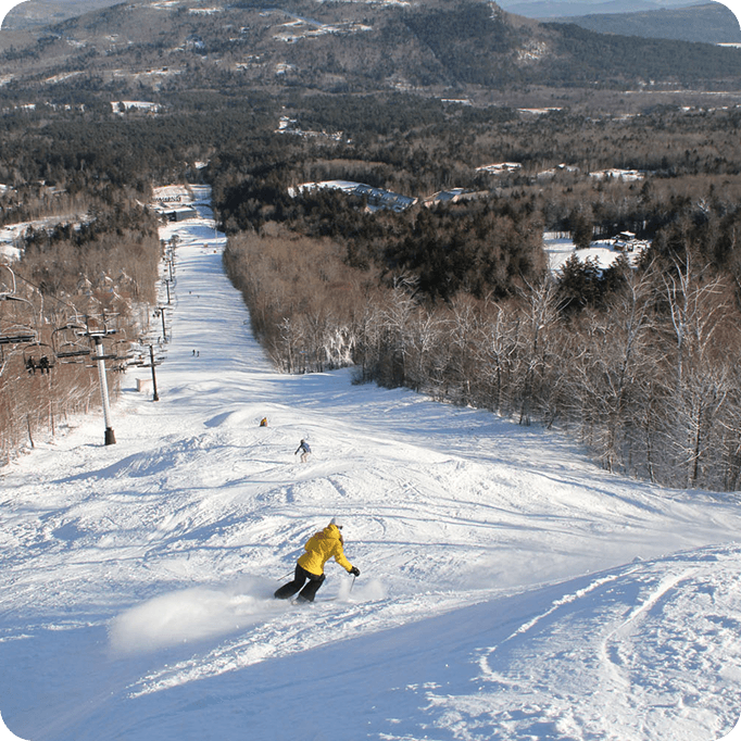 Sunday River ski slopes in winter — 10 minutes from Mountain Vista Log Cabin Bethel Maine